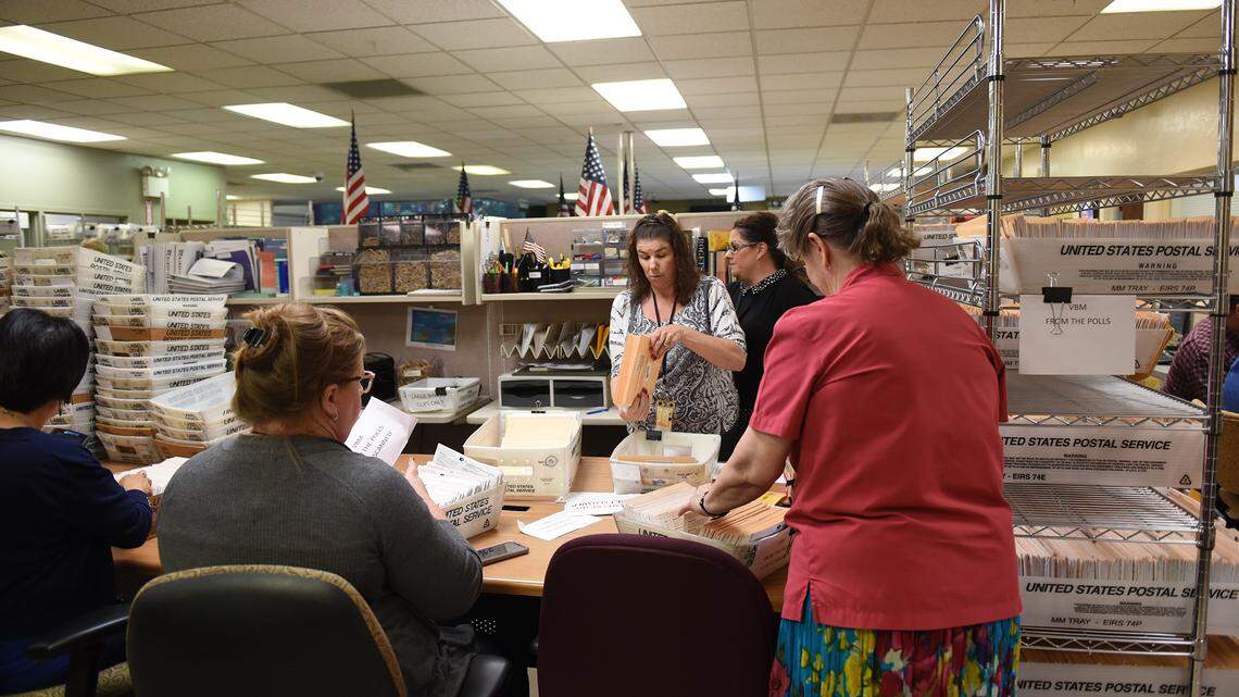 Election workers sort ballots Wednesday afternoon June 6, 2018 at the Stanislaus County Registrar of Voters office in downtown, Modesto, Calif.