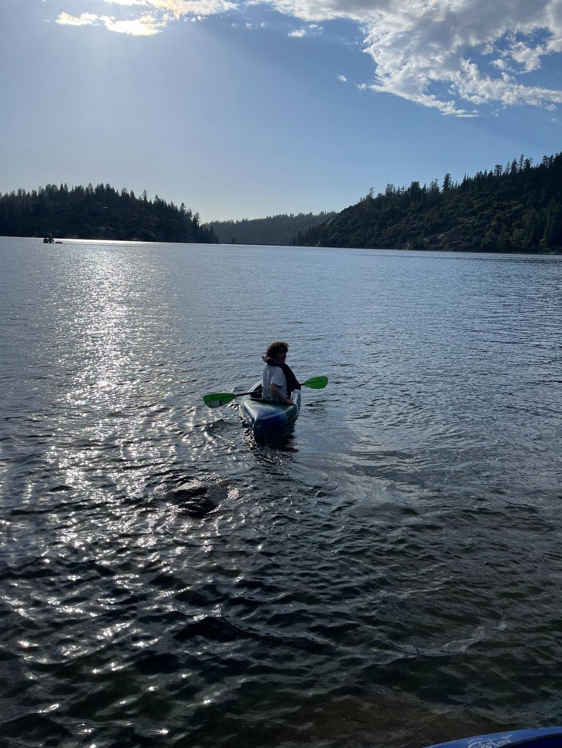 A kayaker wears a life jacket on Pinecrest Lake in Tuolumne County on Monday, June 10, 2024.