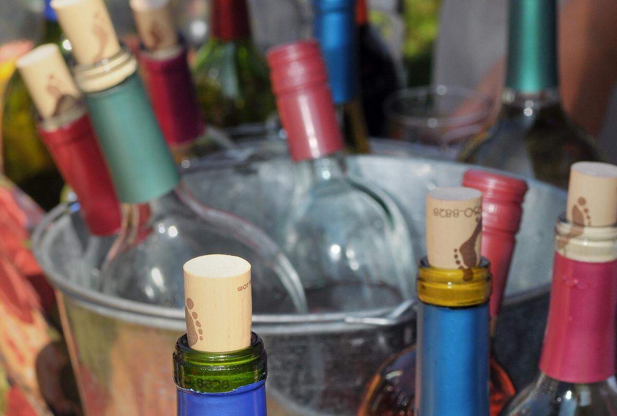 Wine bottles pile up at a past year’s Riverbank Cheese & Wine Festival.