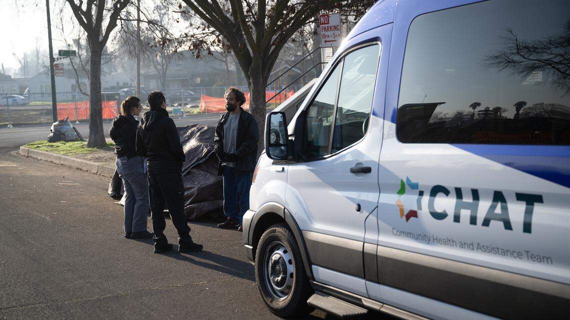 
Members of the Modesto Police Department’s Community Health and Assistance Team talk with an unhoused person during the county’s point-in-time homeless count in Modesto on  Thursday, Jan. 30, 2025.