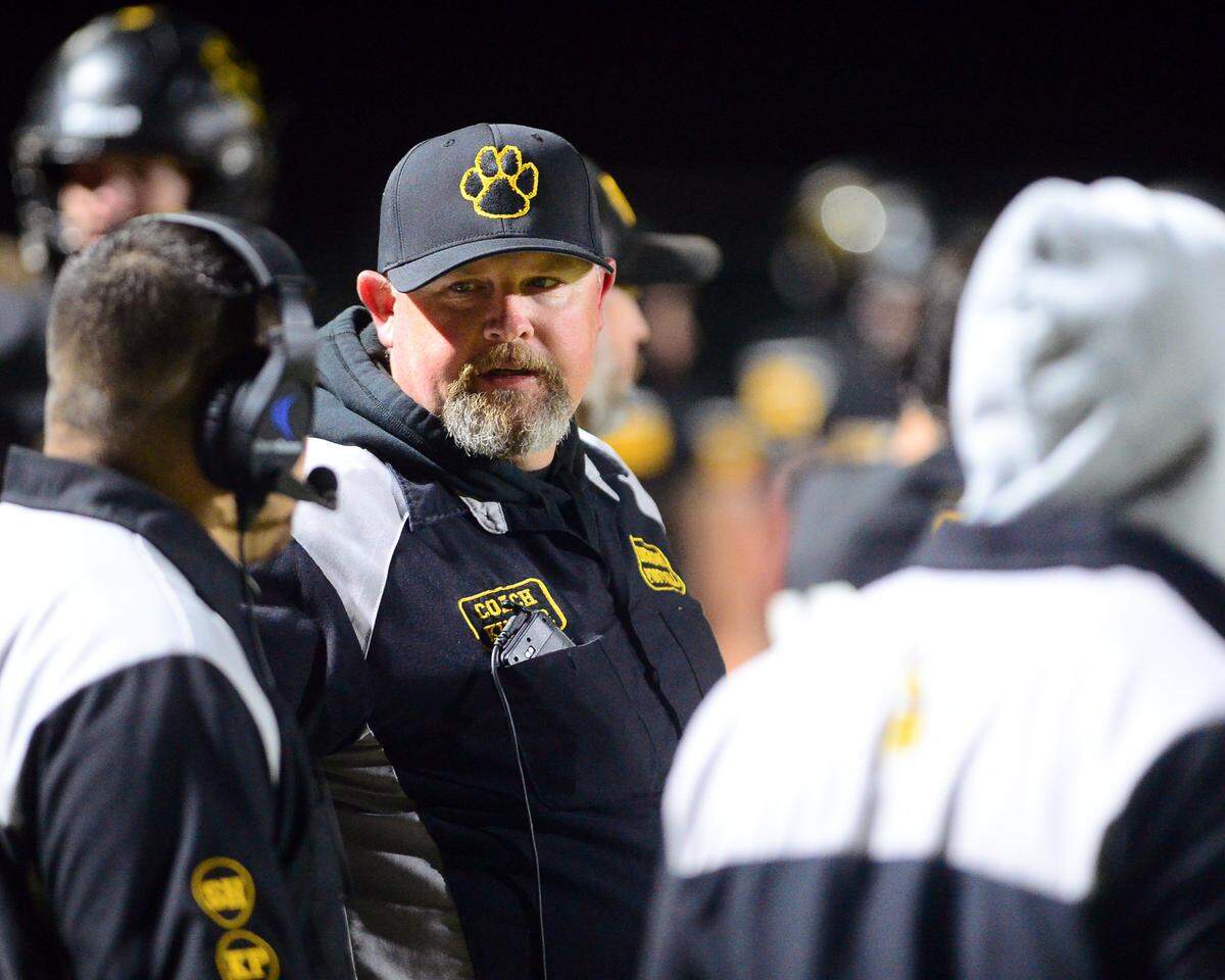 Hughson High School Head Coach Shaun King talks to one of his coaches during a 2023 CIF Division 4-A Northern California Bowl game between Hughson and Palma at Hughson High School in Hughson, Calif. on Saturday, Dec. 2, 2023. Palma won the game 31-21.