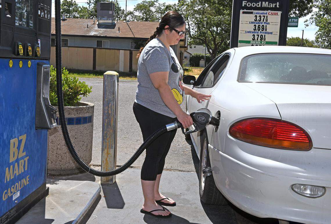 Modesto resident Monique Rivera pumps gas on Monday afternoon July 1, 2019 at BZ Mart on Miller avenue in Modesto, Calif.