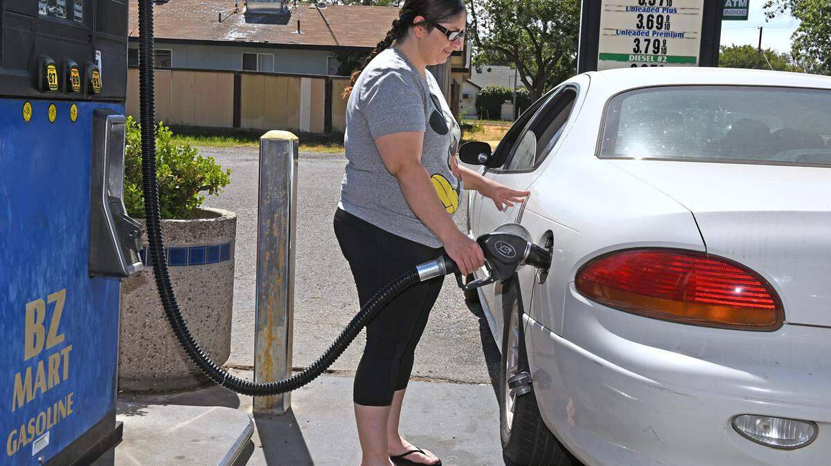 Modesto resident Monique Rivera pumps gas on Monday afternoon July 1, 2019 at BZ Mart on Miller avenue in Modesto, Calif.
