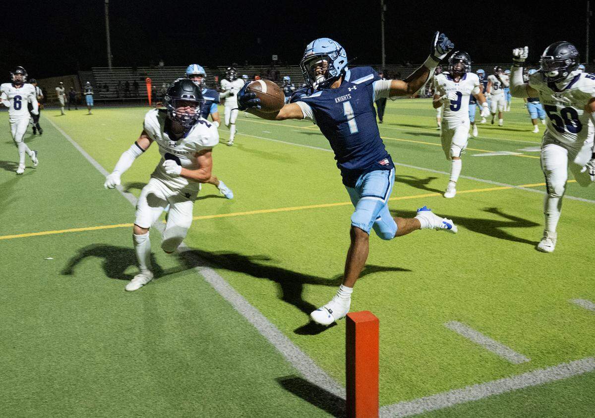 Downey’s Julius Padron runs the ball to the goal line for a touchdown during the non-league game with Amador Valley at Downey High School in Modesto, Calif., Friday, Sept. 13, 2024. Downey won the game 47-38.