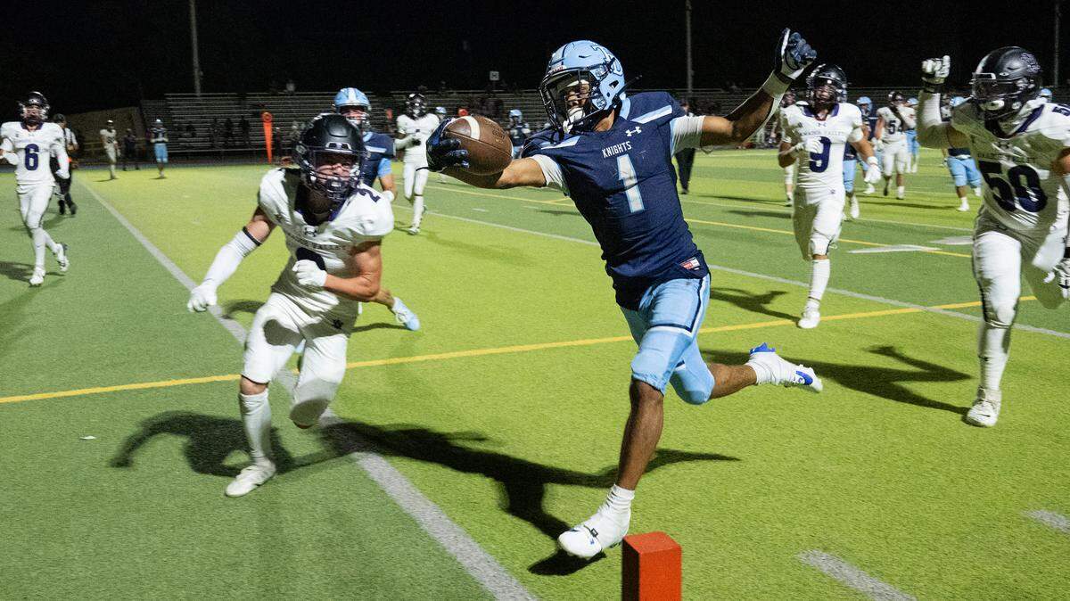 Downey’s Julius Padron runs the ball to the goal line for a touchdown during the non-league game with Amador Valley at Downey High School in Modesto, Calif., Friday, Sept. 13, 2024. Downey won the game 47-38.