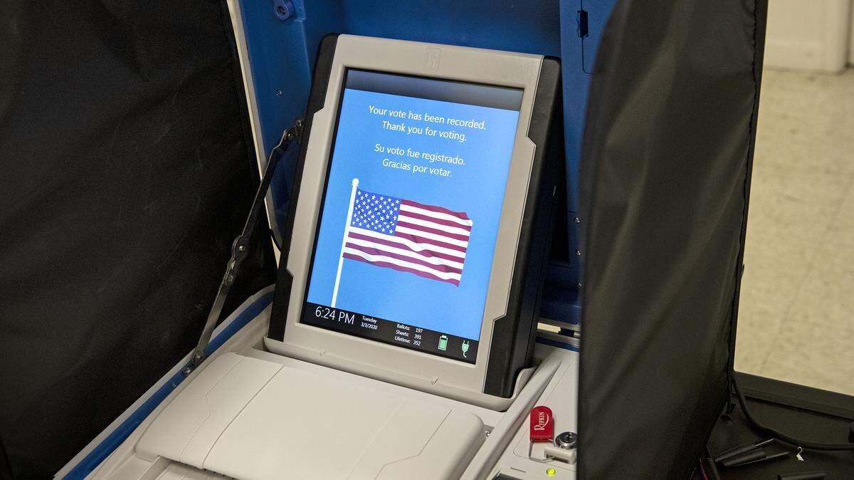 Verity Scan voting machine confirms a voter’s paper ballot has been scanned and recorded inside at Geneva Presbyterian Church polling place in Modesto, Calif., on Tuesday, March. 3, 2020.