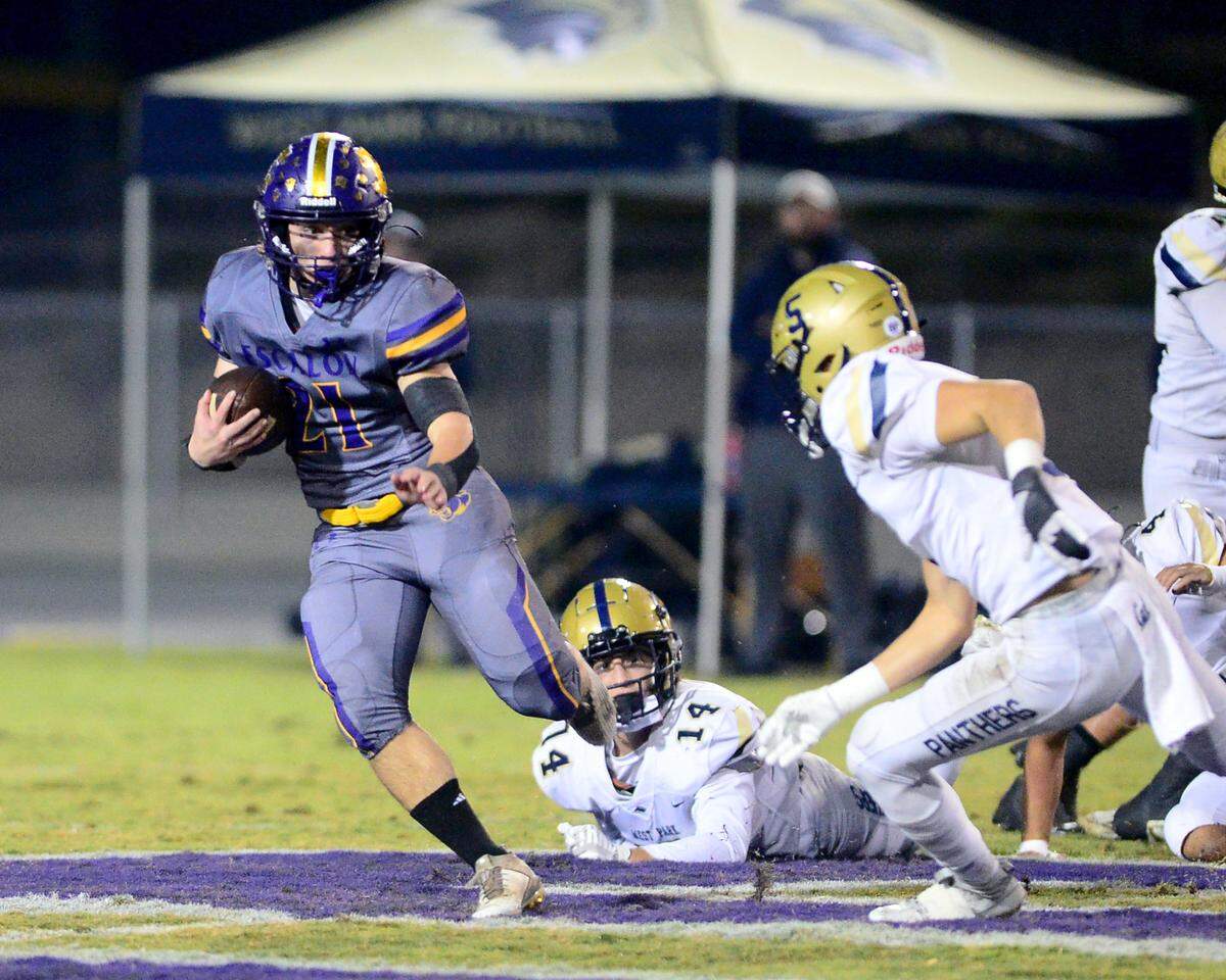 Escalon running back Josh Graham (21) cuts to the outside during a 2023 CIF San Joaquin Section Division IV football game between Escalon and West Park at Escalon High School in Escalon, California, on Nov. 17, 2023. Escalon won the game 48-28.