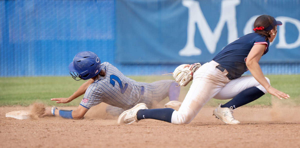 Kayleen Zayehmoureh (2) slides safely into second base during the game with Santa Rosa Junior College at Modesto Junior College in Modesto, Tuesday, April 15, 2025.
