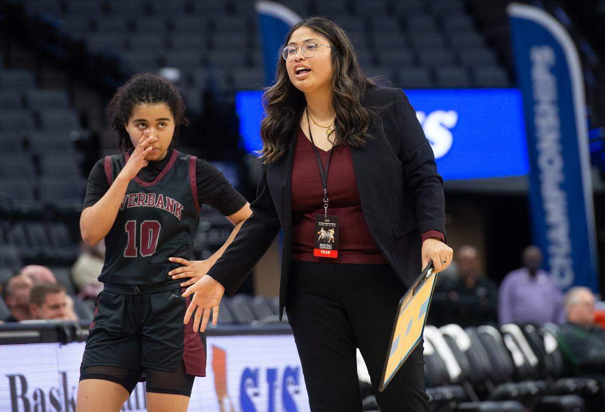 Riverbank coach Janelle Luu talks with her team on a timeout during the Sac-Joaquin Section Division IV championship game with Colfax at Golden 1 Center in Sacramento, Calif., Friday, Feb. 24, 2023.