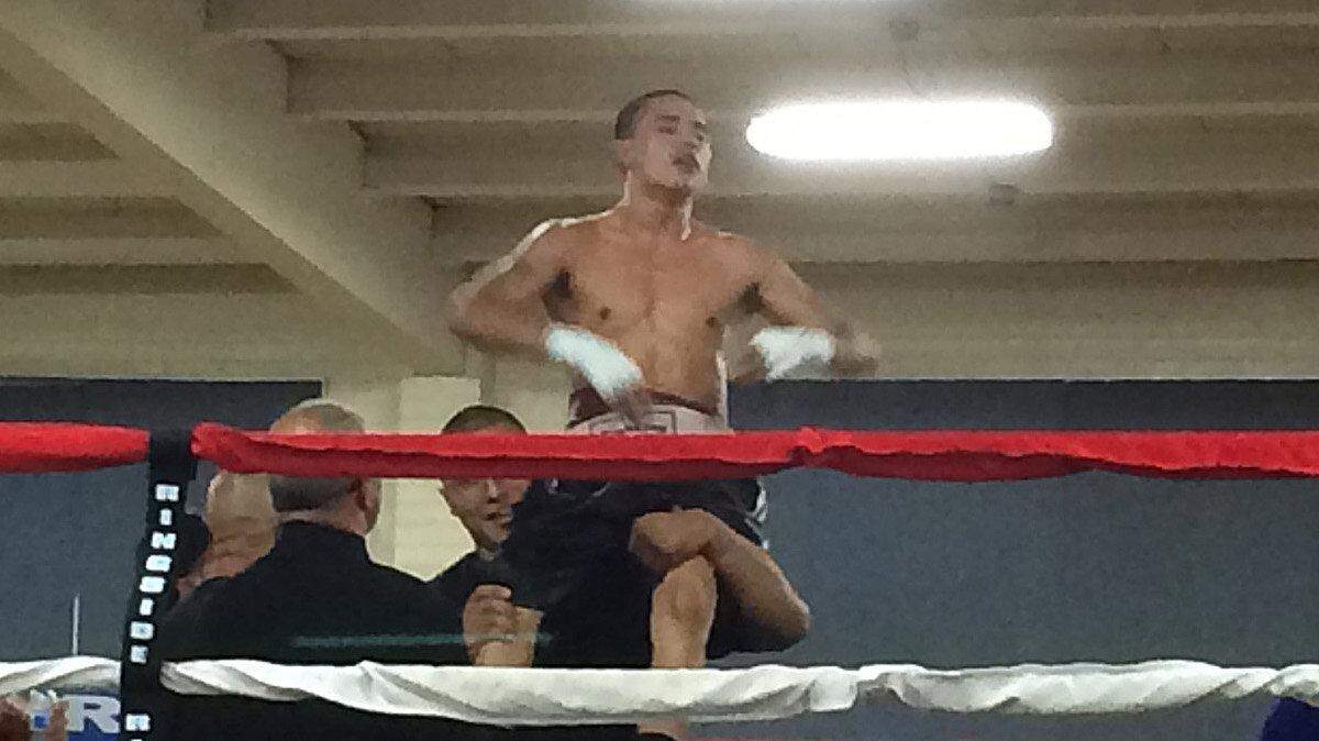Modesto fighter Michael Gaxiola is lifted up after it was announced he won a decision over fellow Modesto boxer Victor Torres in their professional debut bout at the SOS Club in Modesto, Calif., on Saturday, Sept. 6, 2014.