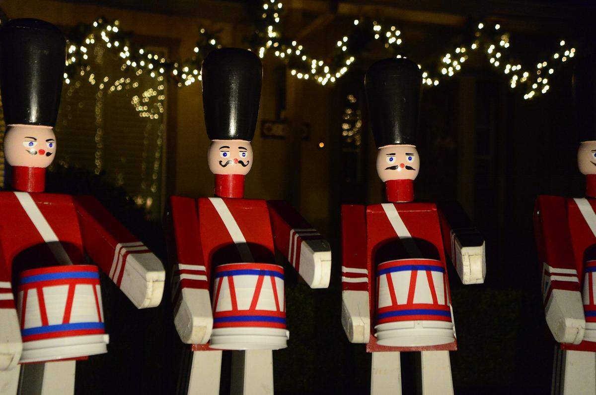Nutcrackers stand together on the front lawn of a home at Christmas Tree Lane in Ceres on Thursday (12-18-14).