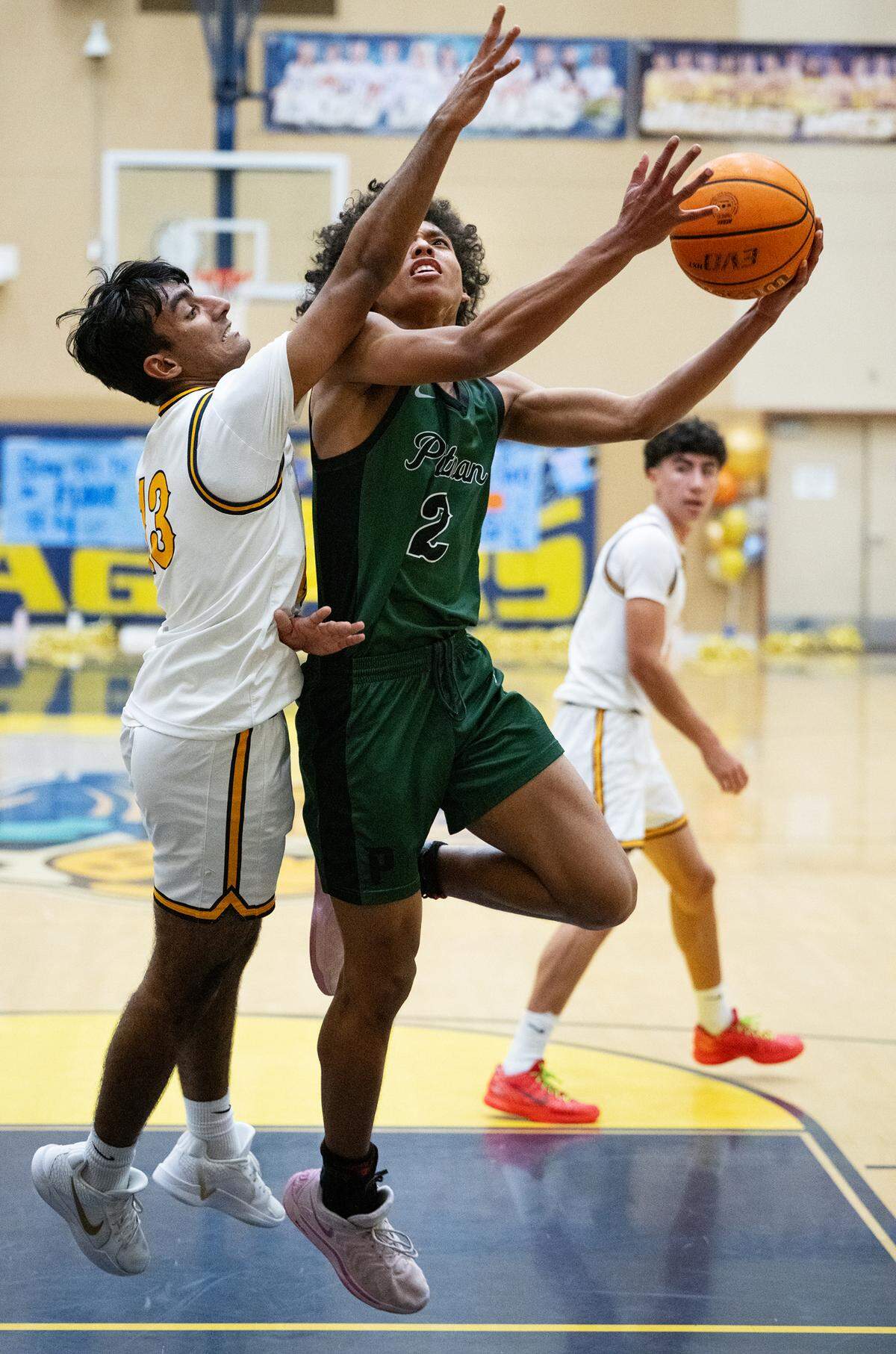 Pitman’s Cole Martin scores past Gregori’s Rajan Sandhu during the Central California Athletic League game at Gregori High School in Modesto, Wednesday, Feb. 12, 2025.