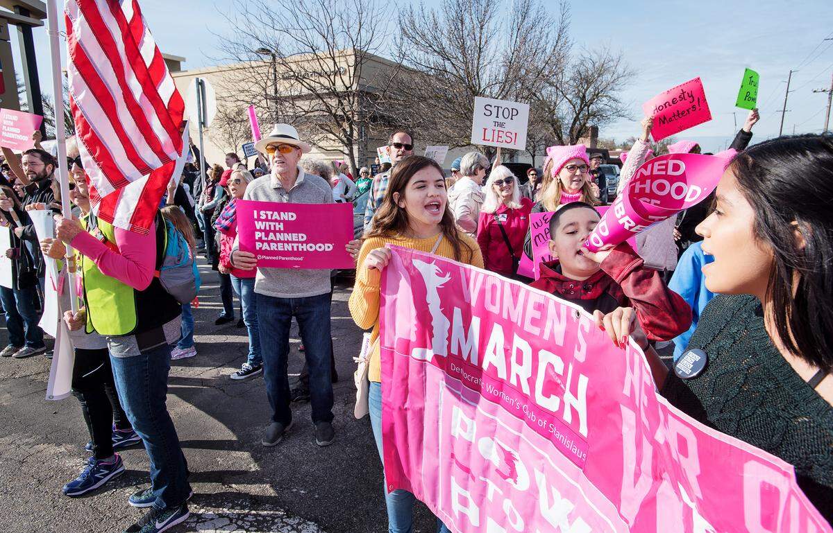 Protesters rally on McHenry Avenue before the during the Modesto Women’s March in Modesto, Calif., Saturday, Jan. 19, 2019.
