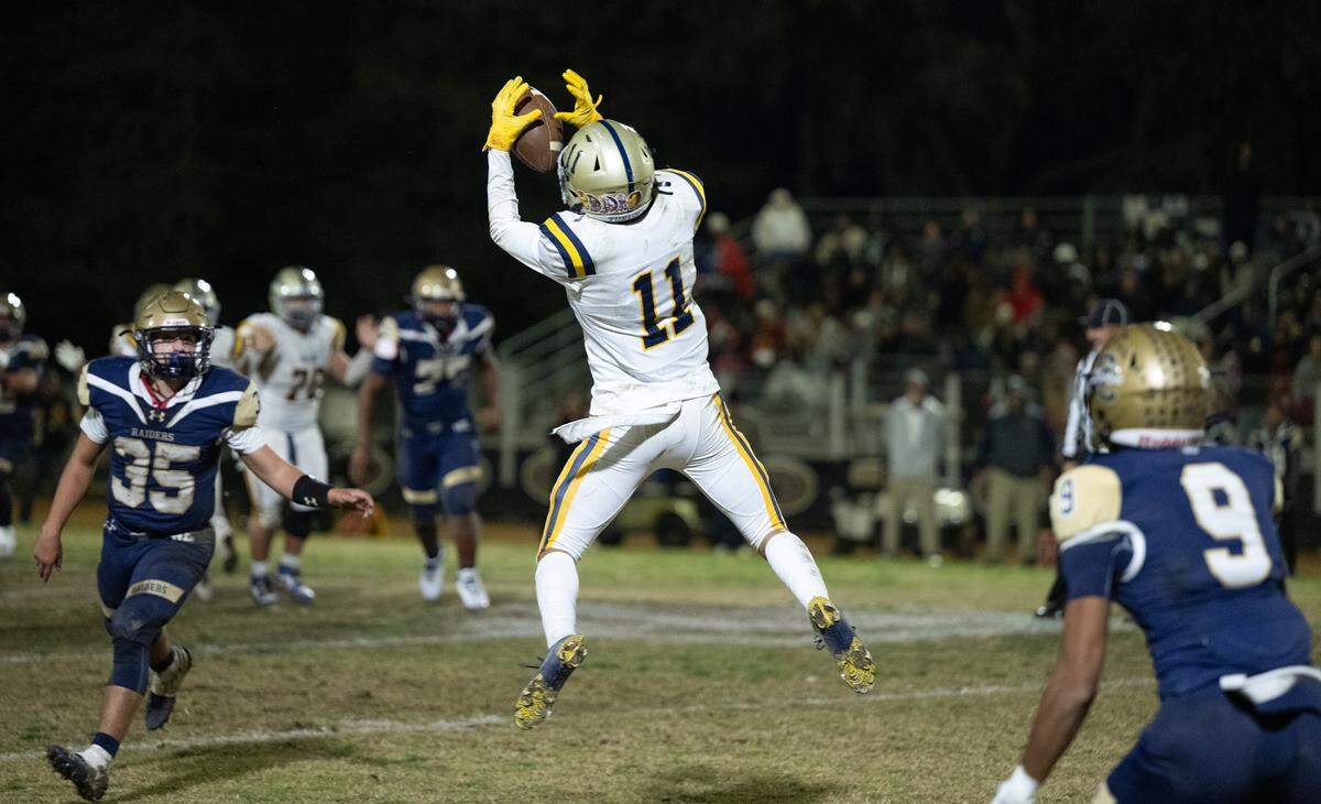 Turlock’s Landyn Fitzgerald (11) makes a catch during the third quarter in the Sac-Joaquin Section Division I playoff game with Central Catholic at Central Catholic High School in Modesto, Friday, Nov. 15, 2024.