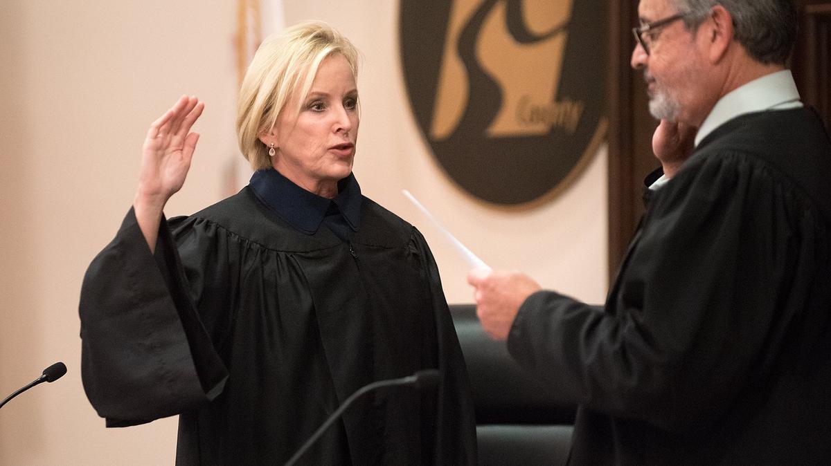 Carrie M. Stephens, left, is sworn in as the newest judge for the Stanislaus County Superior Court by Judge Ricardo Cordova during an investiture ceremony at the Board of Supervisors Chambers in Modesto, Calif., on August 24, 2018.