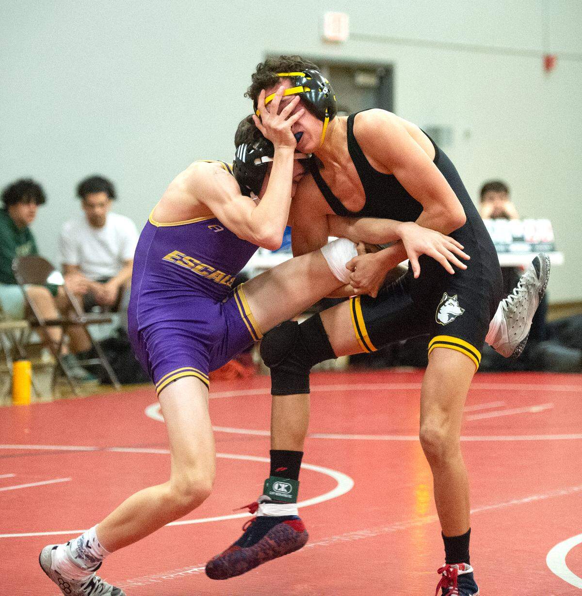 Escalon’s Luca Cerasi and Hughson’s Landon Mason, right, battle in the semifinal match during the Sac-Joaquin Section team duals wrestling championship at Lincoln High School in Stockton, Calif., Saturday, Jan. 28, 2023. Cerasi won the match and Escalon advanced to the team Division 5 final.