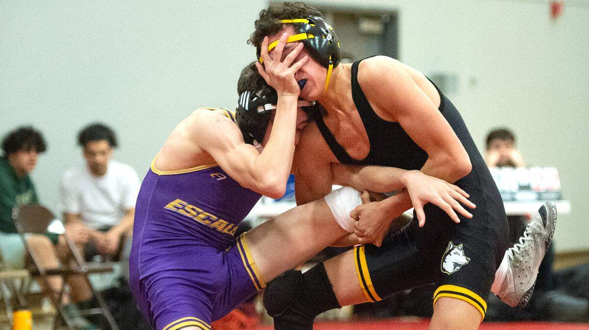Escalon’s Luca Cerasi and Hughson’s Landon Mason, right, battle in the semifinal match during the Sac-Joaquin Section team duals wrestling championship at Lincoln High School in Stockton, Calif., Saturday, Jan. 28, 2023. Cerasi won the match and Escalon advanced to the team Division 5 final.