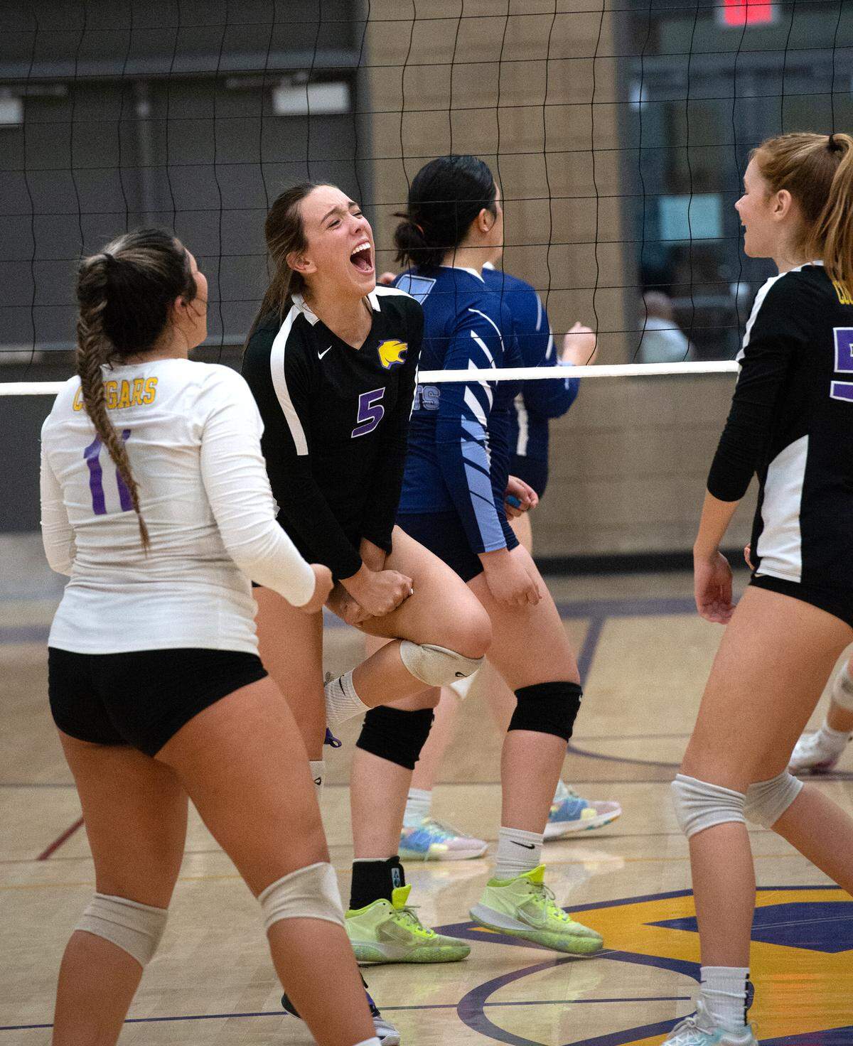 Escalon’s Emily Vickers celebrates with teammates Faye Hernandez (11) and Claire Barkus, right, during a non-league match with Downey in Escalon, Calif., on Tuesday, September 27, 2022.