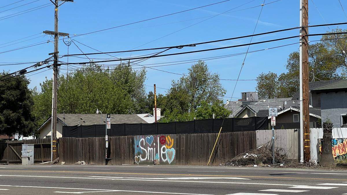 The word ‘smile’ is seen tagged on a fence on Carpenter Road in west Modesto on Tuesday, April 16.