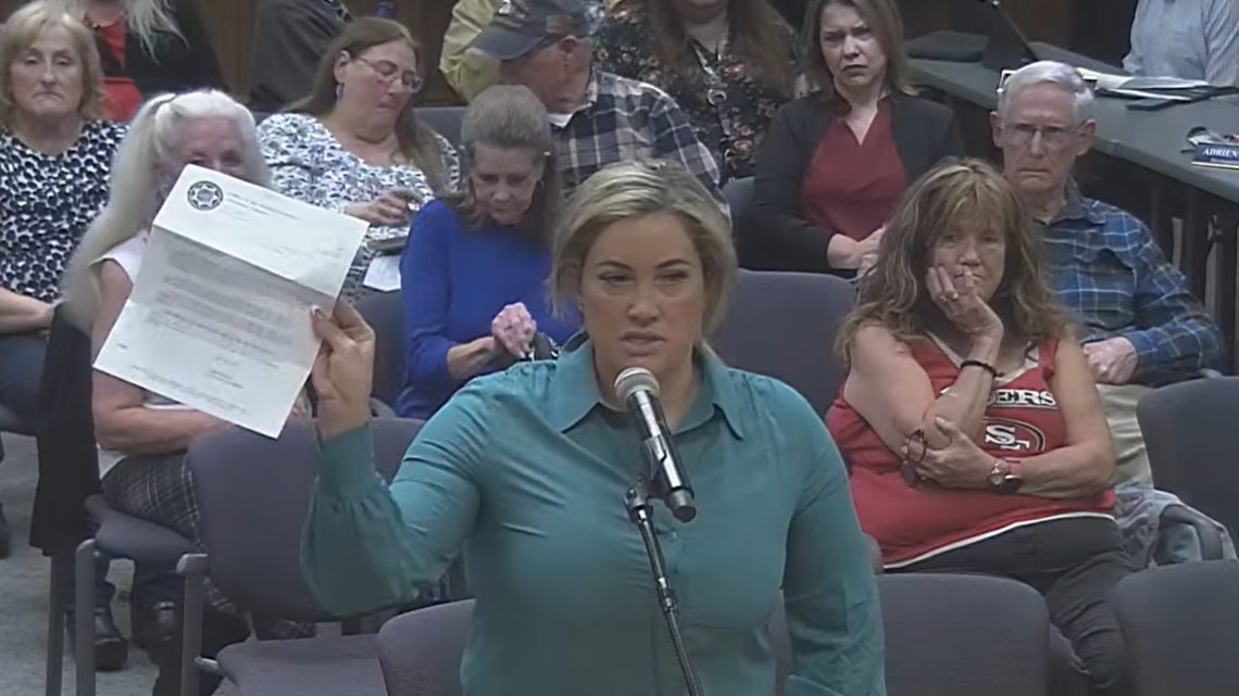 Kelley Coelho holds up a letter sent from the Stanislaus County District Attorney’s Office at the April 14, 2026, Turlock City Council meeting.