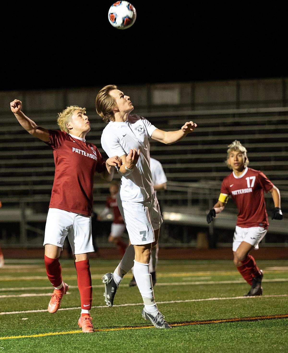 Patterson’s Jonathan Herrnandez and Vista del Lago’s Josh Moll battle for the ball in the Sac-Joaquin Section Division III title game at Turlock High School in Turlock, Calif., on Tuesday, Feb. 22, 2022. Vista del Lago won the championship 2-0.