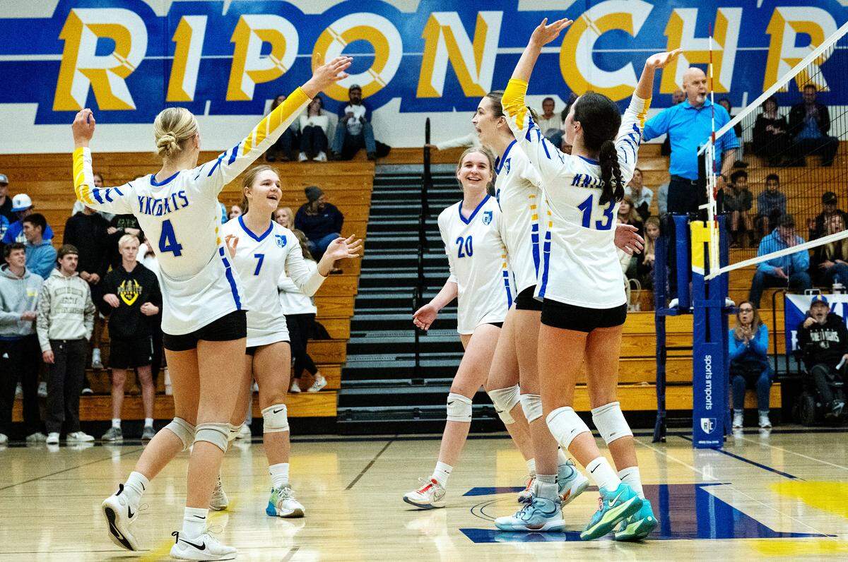 Ripon Christian players celebrate winning a point during the CIF State Division 4 playoff game with West Valley of Cottonwood at Ripon Christian High School in Ripon, Tuesday, Nov. 12, 2024. Ripon Christian won the match 3-0.