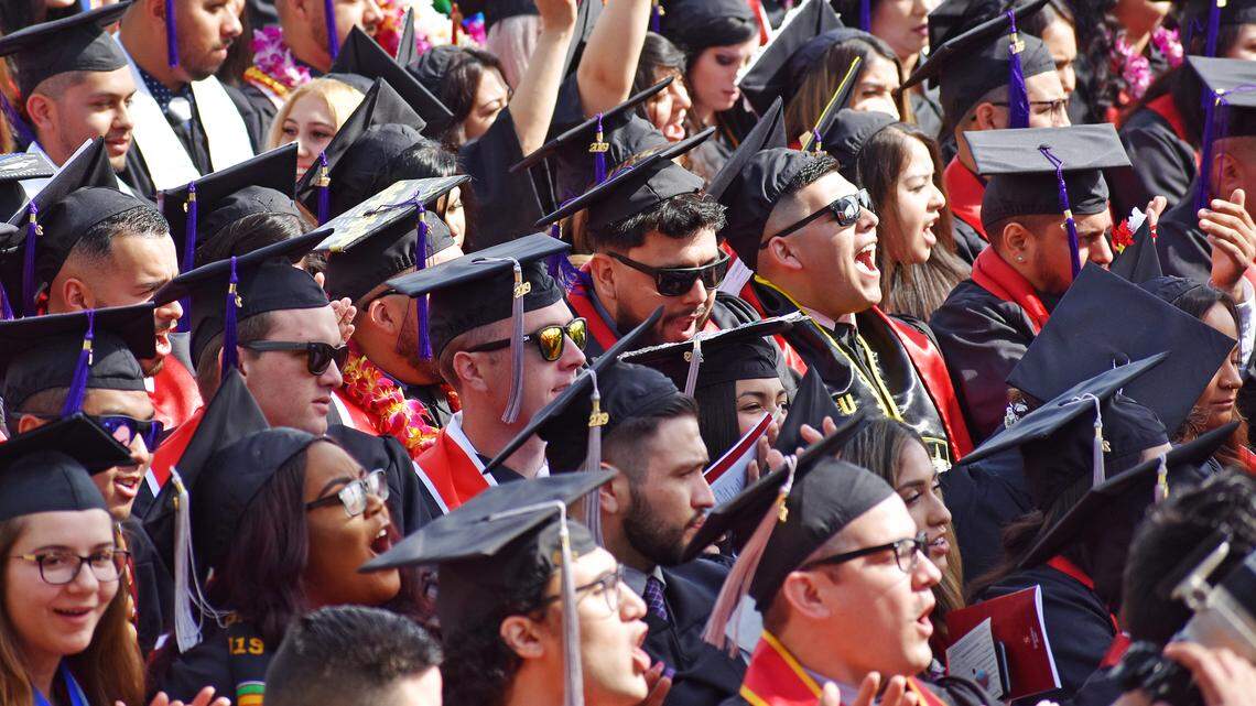 Graduating students cheer during the California State University, Stanislaus, commencement for the College of the Arts, Humanities and Social Sciences on Thursday morning, May 23, 2019.