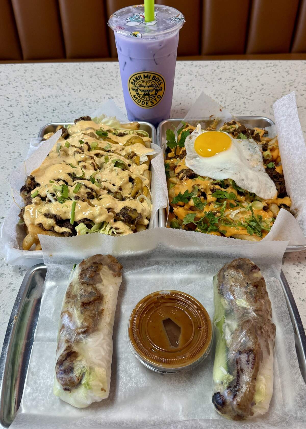 Taro milk tea, K-town fries, smash-burger fries and pork spring rolls from Banh Mi Boys in Modesto