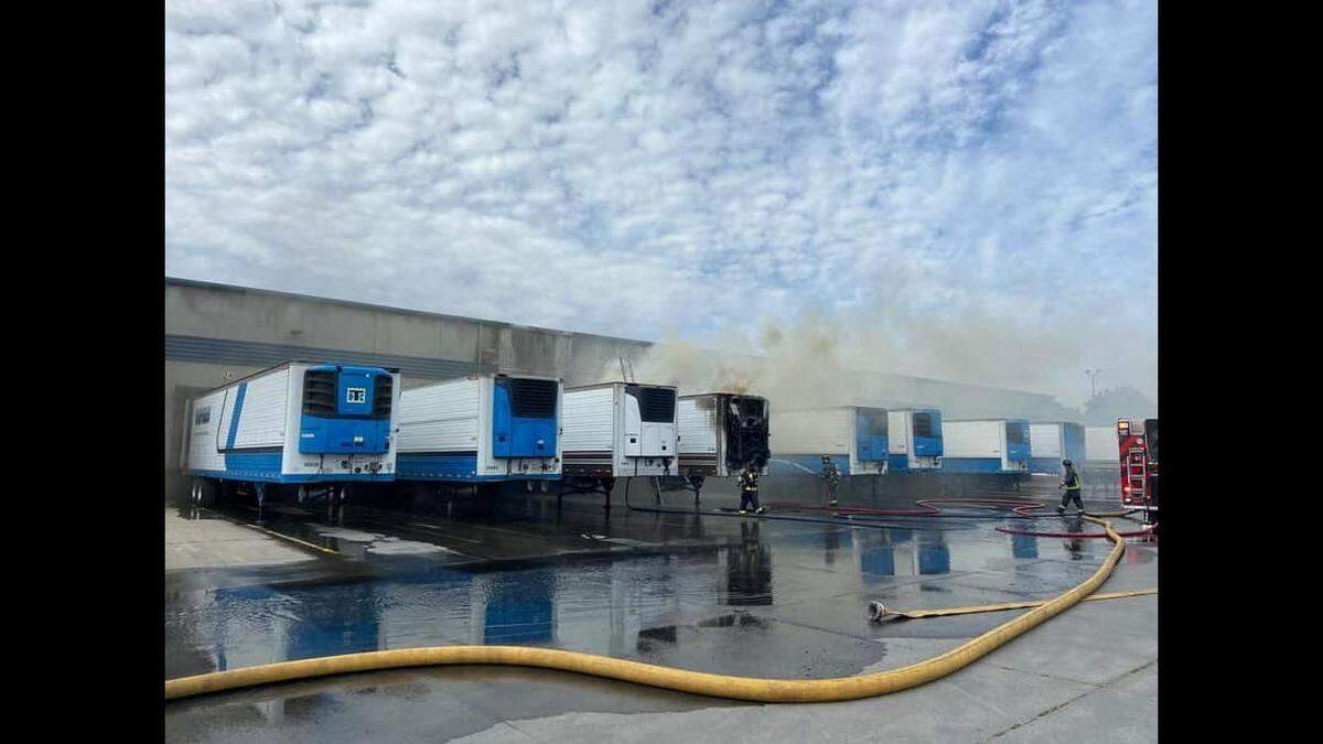 Fire crews respond to a blaze at Northern Refrigerated Transportation in Turlock, Calif., on March 27, 2022.