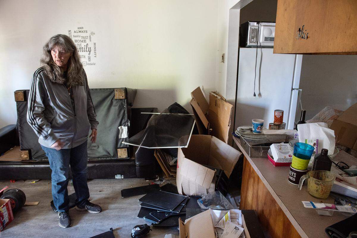 Property manager Lori Beltran shows an apartment where the evicted tenants left the unit littered with trash and furniture. Beltran says most occupants with housing vouchers are good tenants, but a small minority cause extensive damage which result in costly repairs. Photographed in Modesto, Calif., Wednesday, Nov.16, 2022.
