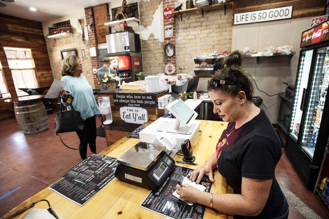 Owner Vicky Rosaia takes an order at The Corral Sandwich Shop in Oakdale, Calif., on Friday, May 1, 2020.