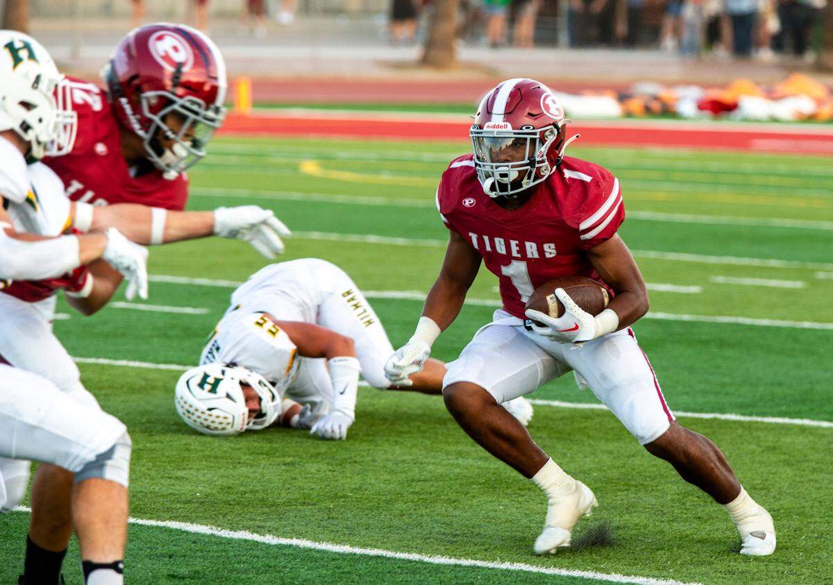 Patterson’s Jeremiah Lugo, 1, works his way up field during the game with Hilmar.