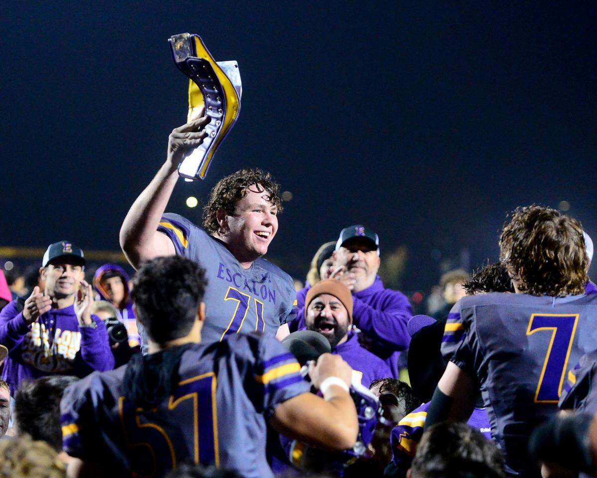 Escalon lineman Ryan Murphy (71) celebrates a win after a 2023 CIF San Joaquin Section Division IV football game between Escalon and West Park at Escalon High School in Escalon, California, on Nov. 17, 2023. Escalon won the game 48-28.