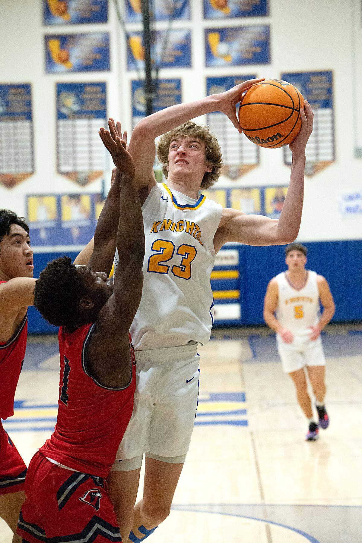 Ripon Christian’s Jace Beidleman attempts a shot over Vacaville defenders during the Sac-Joaquin Section Division V semifinal game with Vacaville Christian at Ripon Christian High School in Ripon, Calif., Wednesday, Feb. 22, 2023.