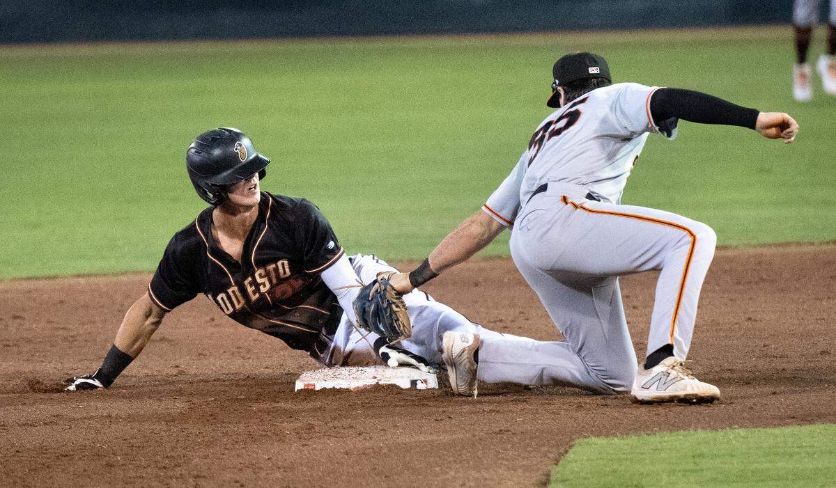 Modesto Nuts’ Carson Jones steals second base during the California League North Division series game with the San Jose Giants at John Thurman Field in Modesto, Calif., Thursday, Sept. 12, 2024.