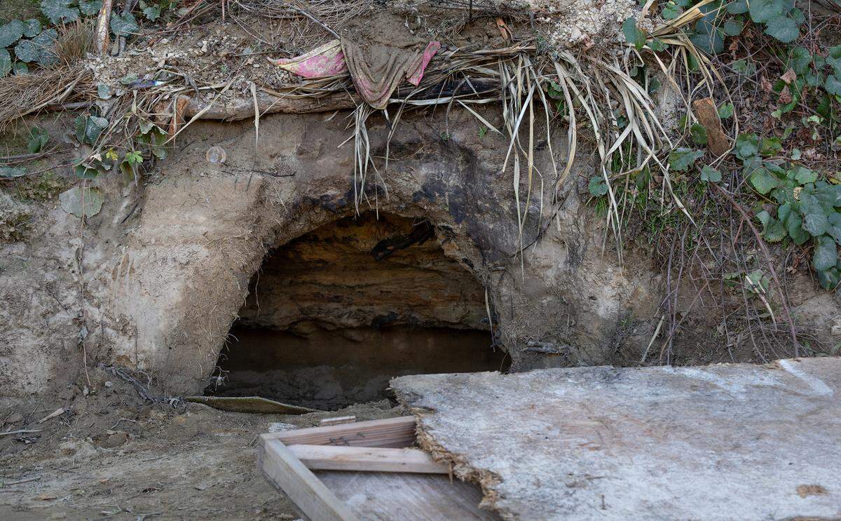 Homeless residents have been digging caves along the south side of the Tuolumne River near Crater Avenue in west Modesto, Calif., Thursday, Oct. 27, 2022.