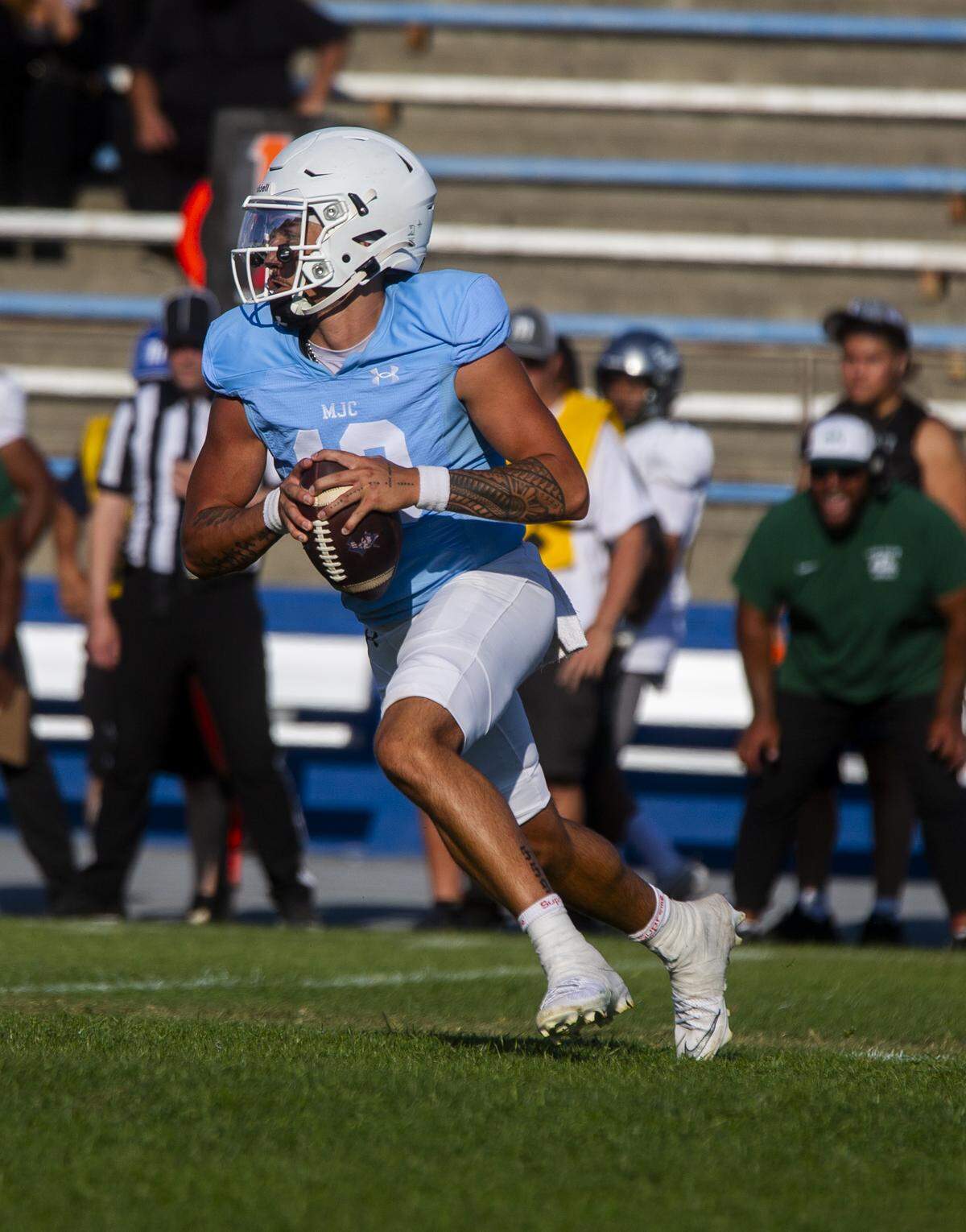Modesto quarterback DayDay Tafoya, 10, looks upfield during the first half of a nonconference game against Laney College at Modesto Junior College on Saturday, Aug. 30, 2025.