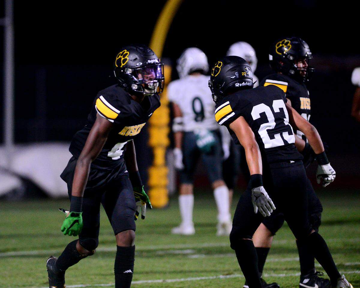 Hughson receiver Malakai Sumter (4) celebrates with Daniel Sotelo (23) after scoring a touchdown during a game between Hughson High School and Central Valley High School at Hughson High School in Hughson California on August 25, 2023.