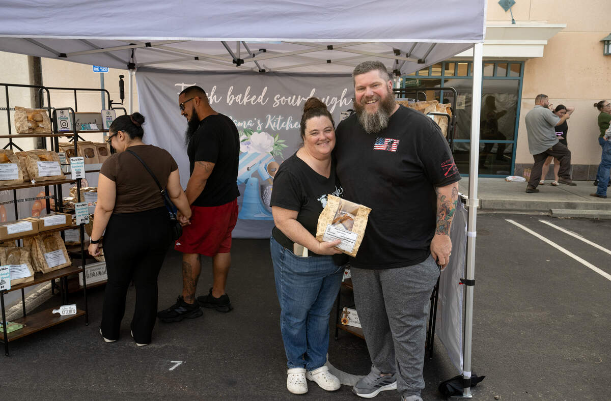 Nama’s Kitchen owner and baker Jamie Ellak with her husband Mike Ellak at the Hughson farmers market in Hughson, Friday, May 29, 2026.