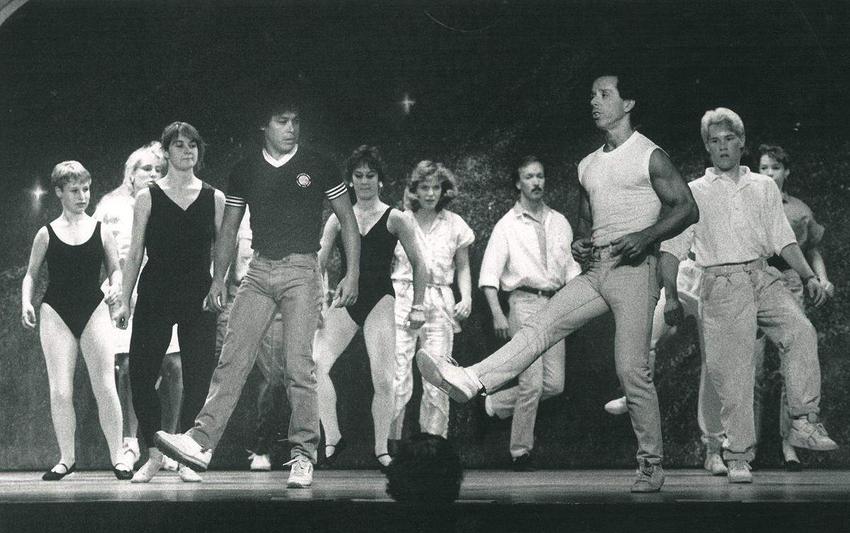 Paul Tischer (second from right) leads dancers during auditions for MPA’s "Oklahoma” in 1988.