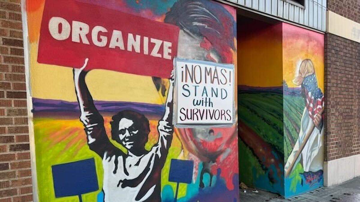 A sign now obscures Cesar Chavez’s face on a mural at the Modesto Peace/Life Center, 829 13th St.