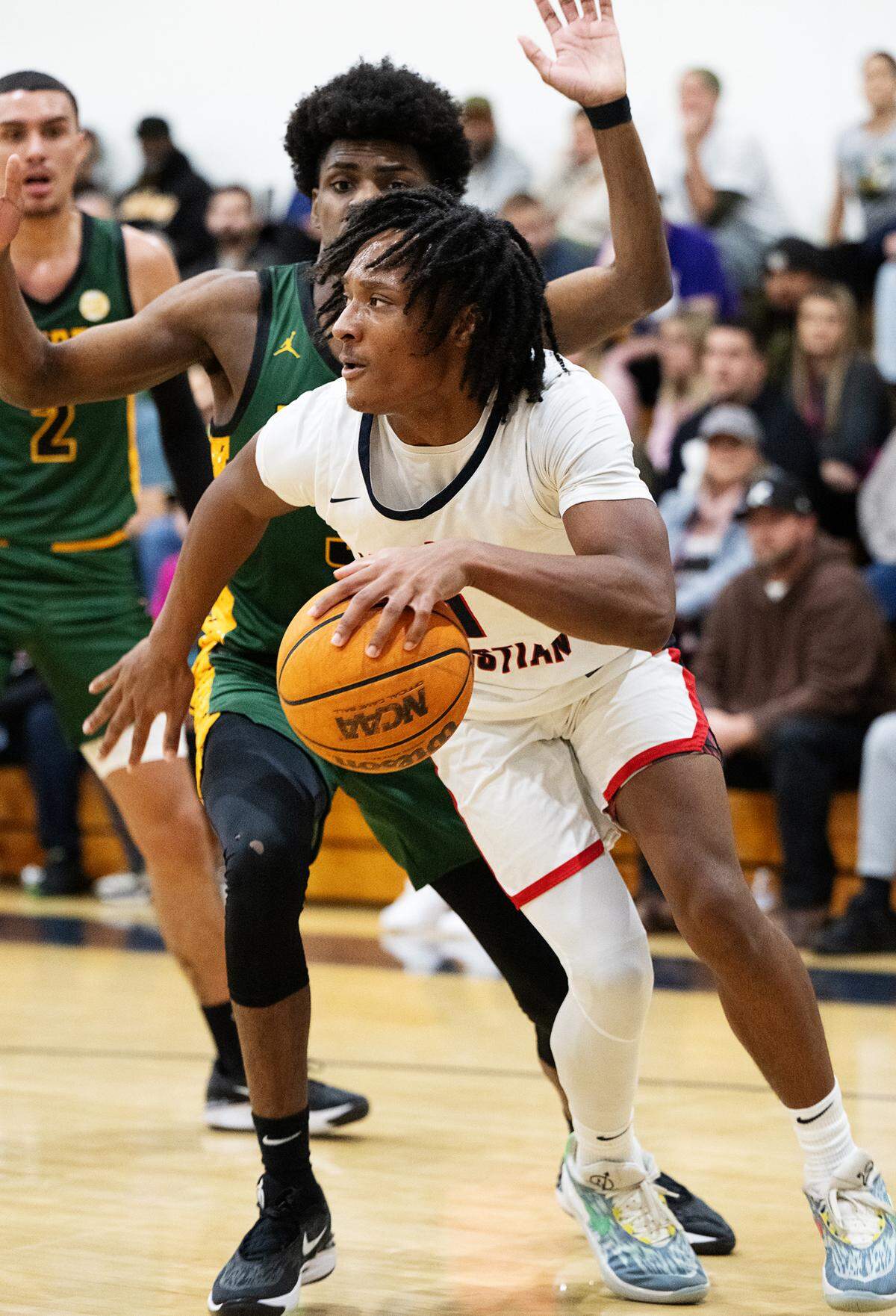 Modesto Christian’s Jeremiah Bernard looks to pass during the Holiday Hoop Classic championship game with Vanden at Modesto Christian High School in Salida, Calif., Saturday, Dec. 30, 2023.