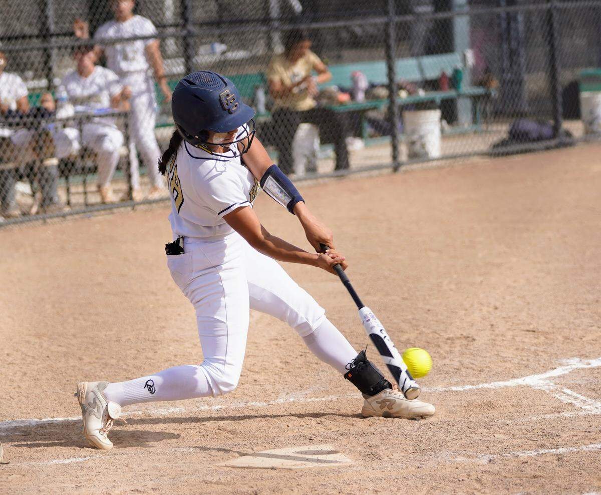 Central Catholic’s Taryn Calderon hits a single during a Valley Oak League game against Manteca at Manteca High School on Tuesday, April 22, 2025.