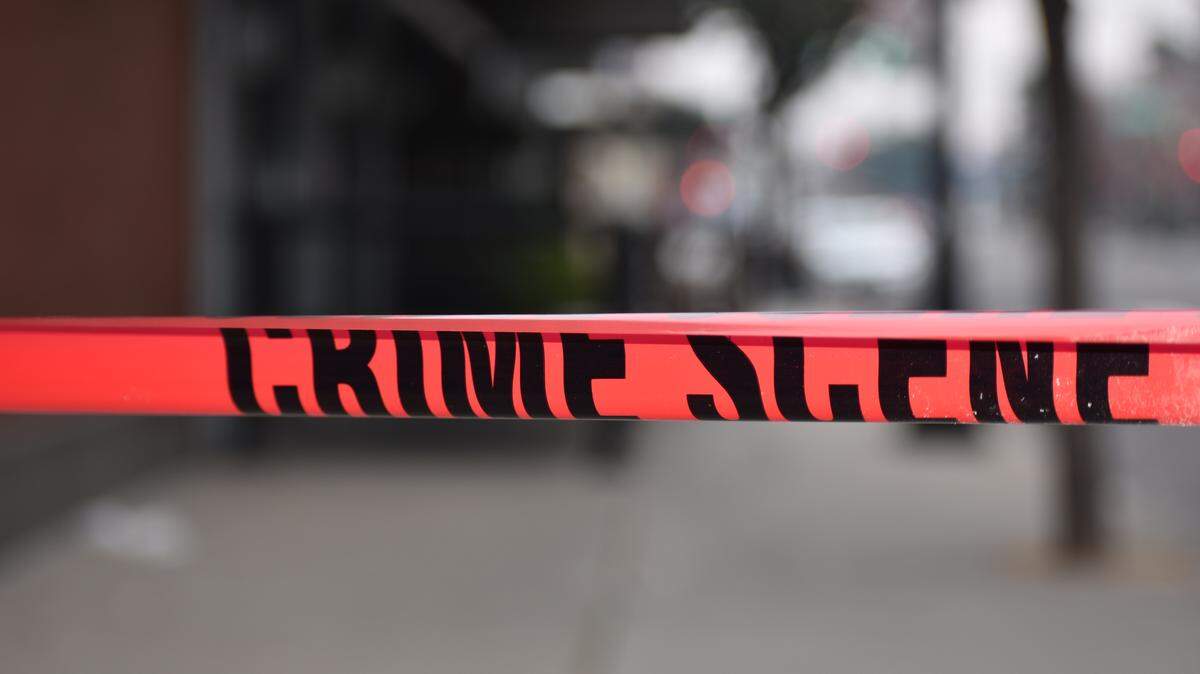 One man was killed and another was wounded when they were struck by gunfire early Sunday (Dec. 24, 2017) at a downtown parking lot. Crime scene tape was left behind where authorities found near 11th and J streets in in Modesto, California.