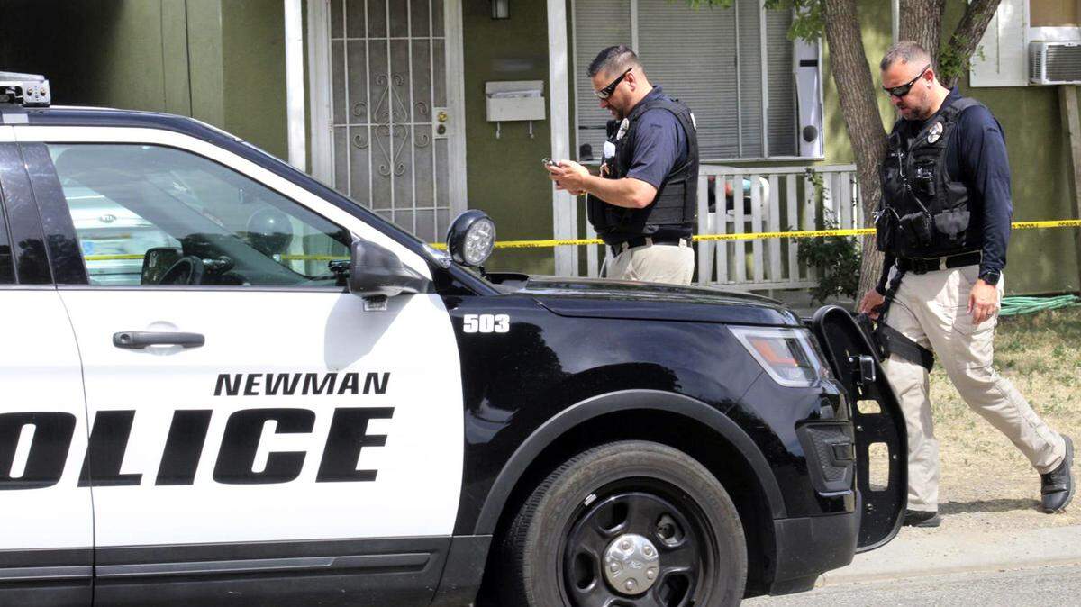 Newman Police officers are on scene Thursday June 27, 2019 on the 1900 block of Pine street in Newman, Calif. where a child was killed by a dog.