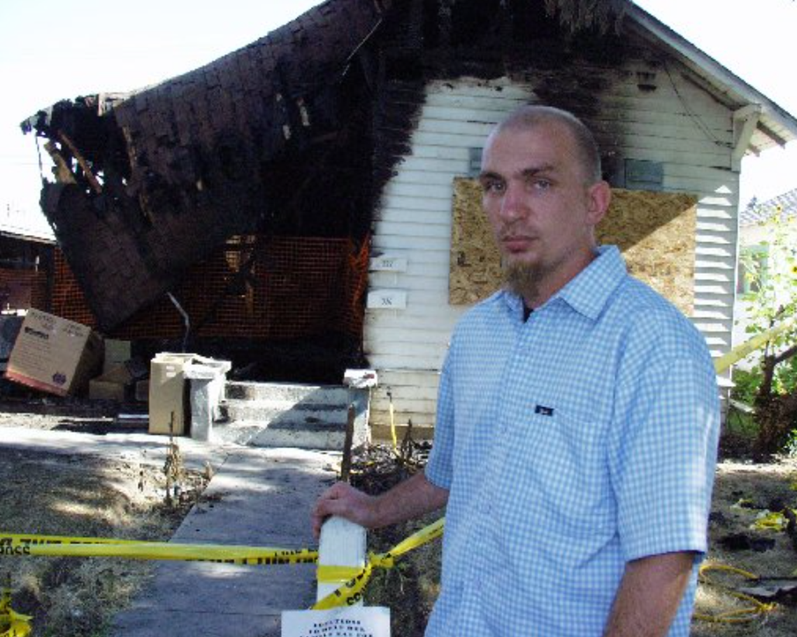 Michael Vanek stands outside the Turlock house in June 2004 where his mother, Kristina Soult, was killed.