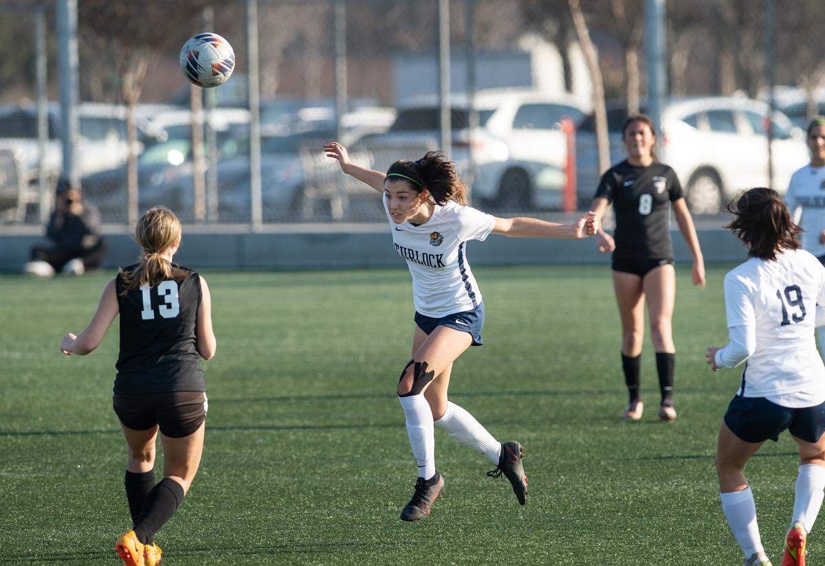 Turlock’s Shaylan Roy-Williams defends with a header during a Central California Athletic League game with Enochs at Mary Grogan Park in Modesto, Calif., Wednesday, Jan. 25, 2023. Turlock won the game 1-0.