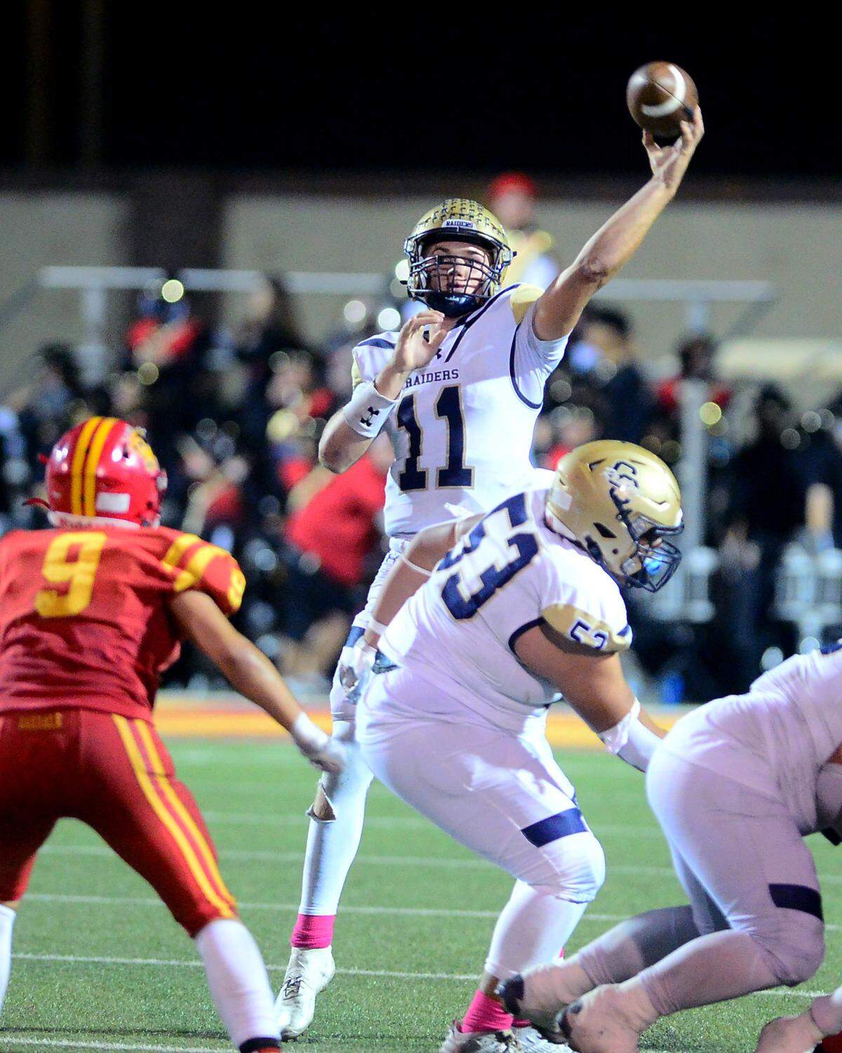 Central Catholic quarterback Tyler Wentworth (11) throws a deep touchdown pass during a game between Oakdale High School and Central Catholic on Oct. 13, 2023.