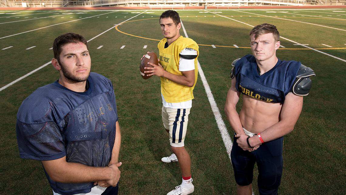 Bulldogs quarterback Jonah Kosakiewicz, middle, with tight end Cameron Sherwood, left, and runningback Lucas Curtis, right, at Turlock high School in Turlock, Ca., on Tuesday, Oct. 23, 2018.