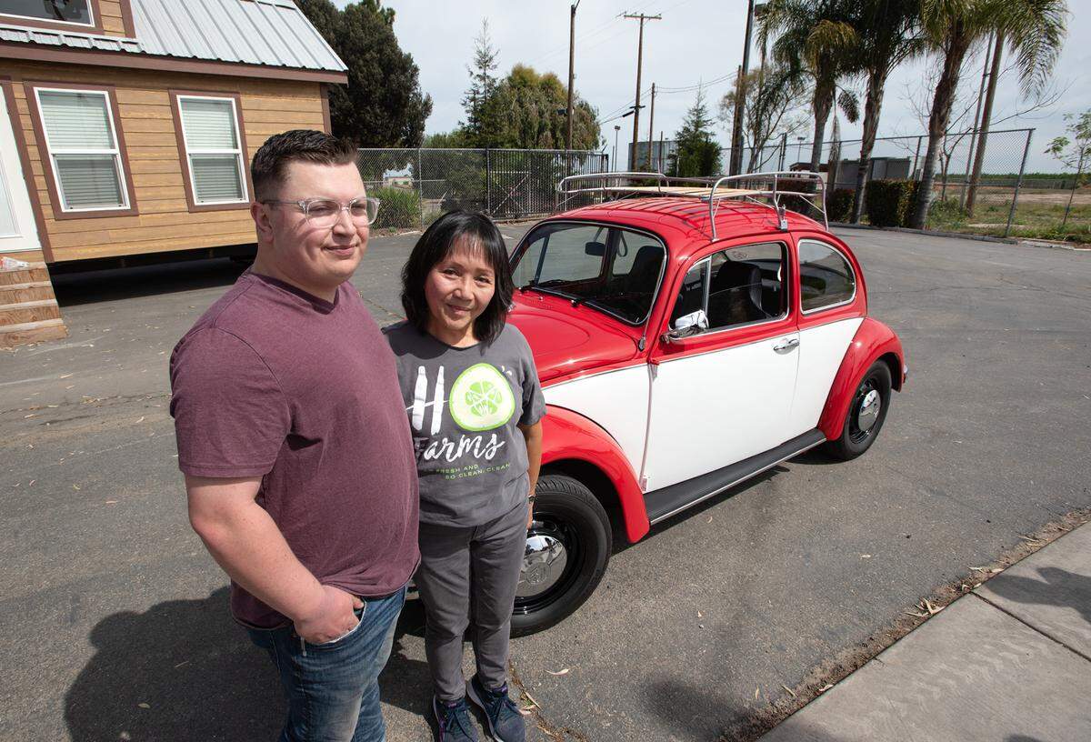 Jody Rodriguez with Taylor Gamino, left, at Camp Taylor. Rodriguez and her husband Michael donated their son’s 1970 Volkswagen Beetle to Camp Taylor, their son, Chase Rodriguez had spent about a dozen summers at the camp. He died in 2018 from a heart attack at the age of 29.